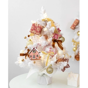 Mini white Christmas tree with gold ornaments and warm LED lights for tabletop decor