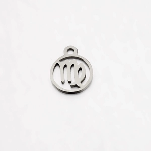 Detailed view of polished stainless steel Virgo zodiac pendant with hollowed-out design