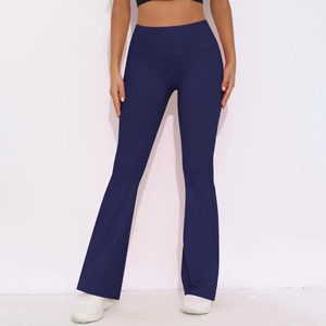 Detail view of high waisted flared yoga pants in dark blue fabric with sleek fit