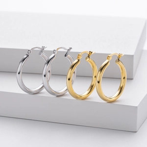 Detailed close-up of S925 sterling silver hoop earrings in gold and silver finishes