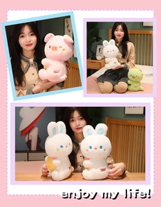 Detailed view of plush pig, rabbit and dinosaur toys held by a model in a cozy setting