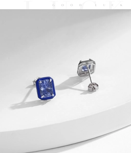 Macro detail of S925 sterling silver stamp and blue enamel edges on square stud earrings