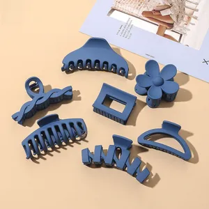 Detailed set of 7 matte Morandi blue claw clips in floral and geometric shapes