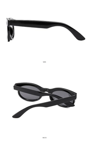 Detailed side and back views of vintage oval sunglasses with narrow black frames