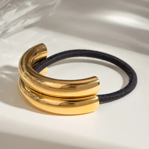 U-shaped stainless steel hair tie with black elastic band and polished gold metal accents