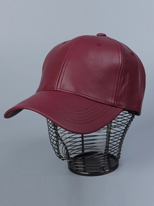 Detailed macro view of dark red PU leather baseball cap featuring fine lychee texture