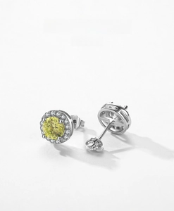 Detailed close-up of S925 silver stud earrings with a bright yellow gem and white zircons