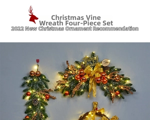 Detail of Christmas pine garland with gold ornaments, pinecones and warm LED lights
