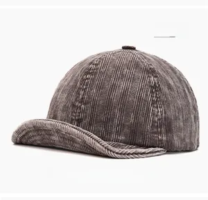Macro shot of grey corduroy texture and vertical striped fabric on the brimless cap