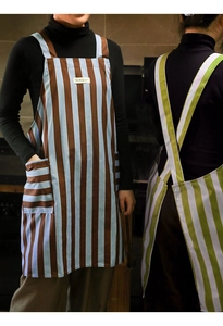 Detail of kitchen aprons showing striped patterns and H-back cross strap design