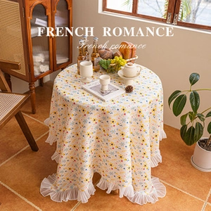 Detail of French floral tablecloth with cream fabric and white double-layer mesh ruffles