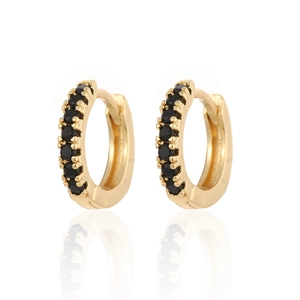 Elegant gold-plated hoop earrings with black zircon stones on a white reflective surface