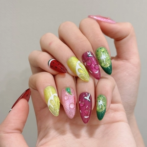 Detail of almond-shaped nails featuring 3D water drops and hand-painted tropical fruit art