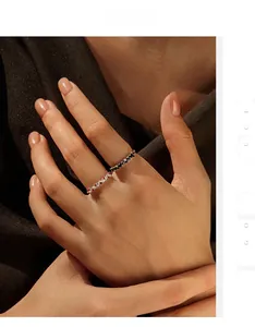 Detail of S925 silver ring featuring red, clear and black multi-color pavé stones