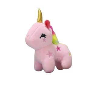Cute pink plush unicorn toy with golden horn and colorful mane on white background