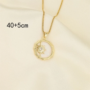 Titanium steel gold necklace with white shell star pendant on yellow silk background