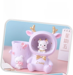 Purple resin deer pencil holder featuring Lucky inscription and floral relief details
