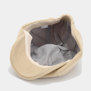 Beige corduroy newsboy cap for men and women featuring warm wool lining and classic style