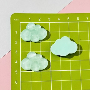 Three light green resin cloud charms on a measuring mat showing 2-3cm size details