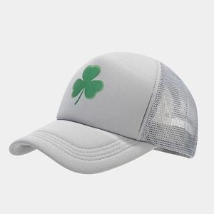 Detail of grey trucker hat with green clover print and breathable white mesh back