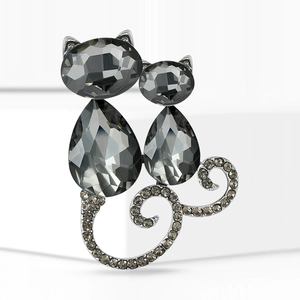 Elegant twin cat brooch in silver finish featuring dark grey crystals and rhinestones