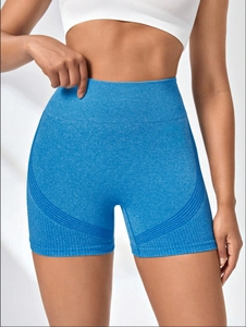 Detail of high-waisted seamless yoga shorts in blue marl fabric with side curved lines