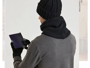 Detailed view of black knitted winter set showing touchscreen gloves and warm scarf