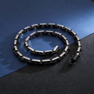 Macro shot of punk hip-hop geometric link chain with black and silver metal finish