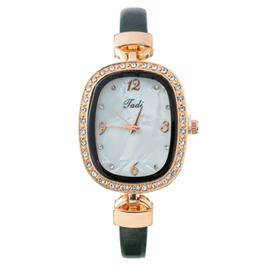 Montre à quartz élégante pour femme avec lunette en cristal et bracelet en cuir vert foncé