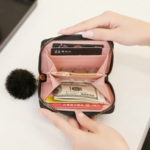 Black quilted small wallet for women with pink interior and cute black pompom keychain