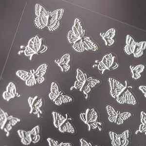 Autocollants 3D papillon blanc pour ongles avec texture relief sur support transparent