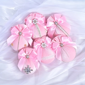 Six pink velvet Christmas ornaments with bows, pearls and diamonds for festive tree decor