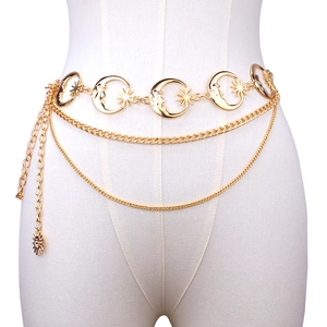 Gold multi-layer metal waist chain belt with crescent moon and star charms on a mannequin