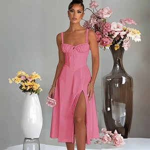 Detail of pink spaghetti strap dress showing side slit and high-quality woven fabric texture