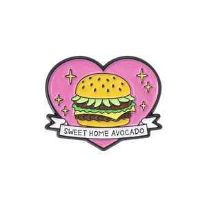 Creative heart-shaped burger and avocado enamel pin with Sweet Home Avocado text