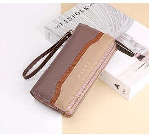 Detail of multi-color long wallet with wave texture, gold logo, and dual zipper closure