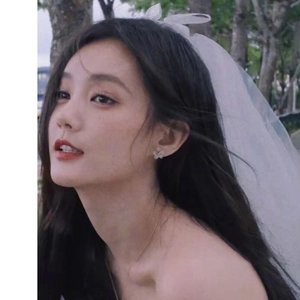 Elegant white bridal veil with bow and floral earrings for wedding photography