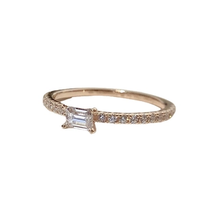 Minimalist rose gold ring featuring a rectangular emerald-cut zircon and pavé band