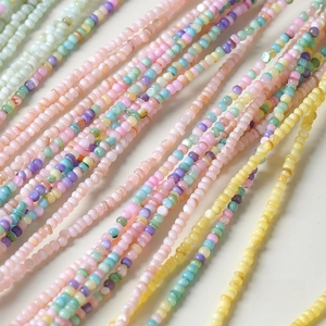 Close-up of 2mm macaron colored natural shell beads for DIY jewelry making and handmade crafts