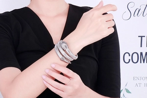 Detail of silver stainless steel wrap bracelet showing realistic snake scale textures