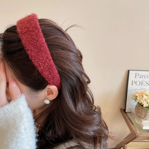 Close-up of red plush headband showing thick faux mohair texture and retro style