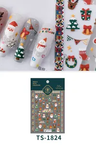 Detailed close-up of 3D embossed Christmas nail art stickers with Santa and reindeer motifs