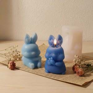 Detailed silicone mold and finished bunny candles for DIY Easter resin crafts and decor