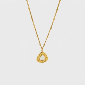 Detail of gold-plated necklace with white shell heart pendant showing 38+5cm chain length