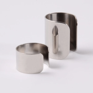 Detailed view of wide and narrow polished stainless steel C-shaped cuff earrings set