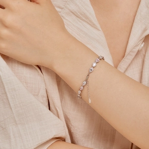 Elegant S925 sterling silver bracelet featuring pink and clear pear-cut zirconia stones