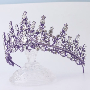 Detailed view of luxury purple metal bridal crown with sparkling crystal rhinestones