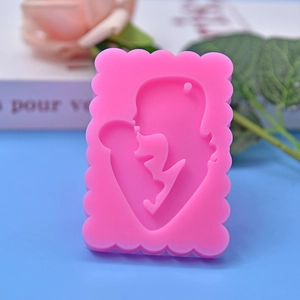 Pink silicone mold featuring a mother and child silhouette for cake and DIY crafts
