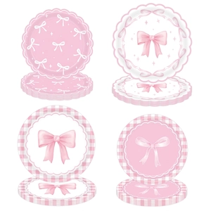 Pink bow birthday party set with scalloped paper plates and ribbon patterns