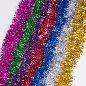 Colorful festive Christmas tinsel garland assortment in vibrant metallic star-shaped fringe